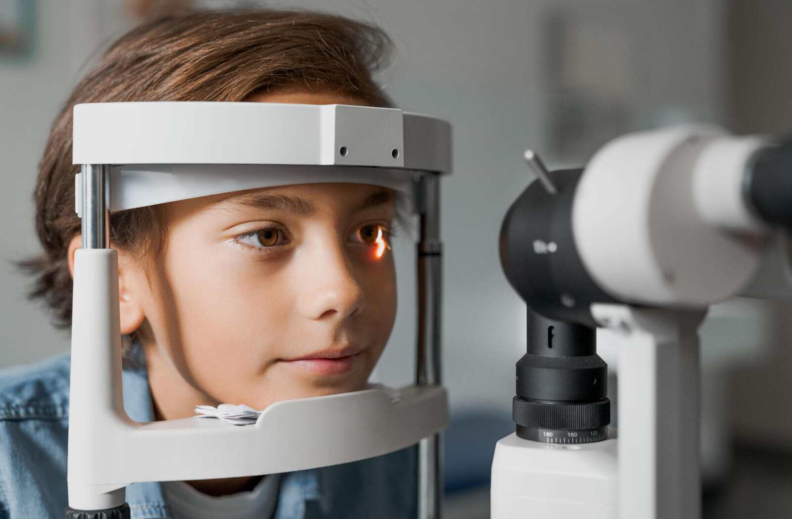 Close-up of a child undergoing a slit-lamp exam