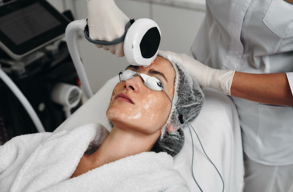 A patient wears protective goggles during their IPL treatment for dry eye.