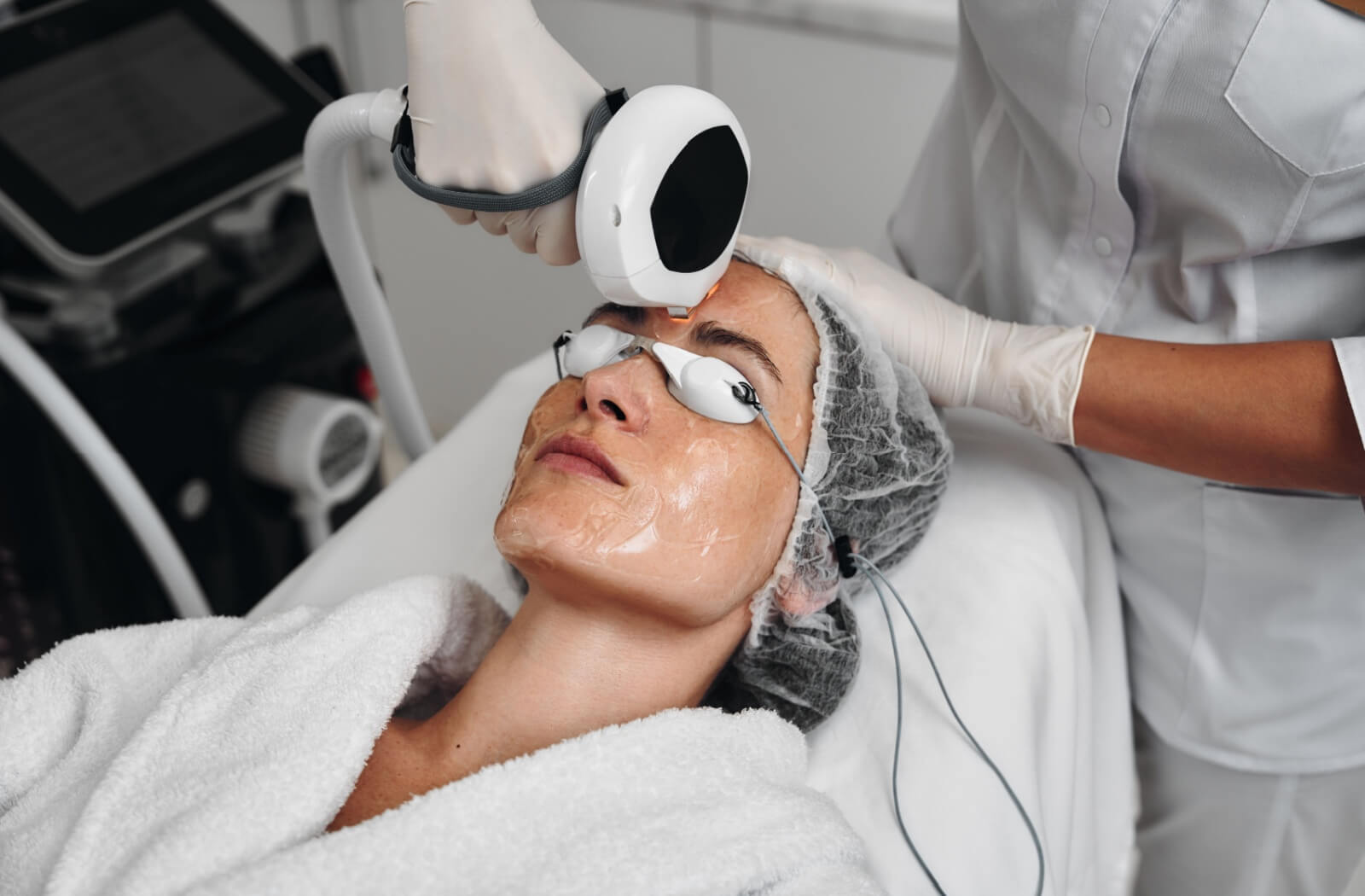 A patient wears protective goggles during their IPL treatment for dry eye.